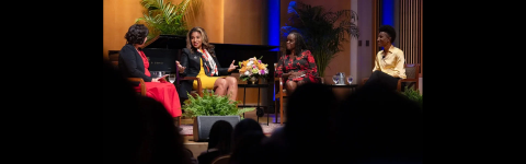four people sitting in a semi circle