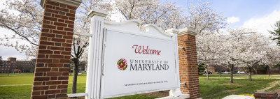 white sign that says 'welcome to the university of maryland'