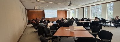 image of people sitting in a  conference room