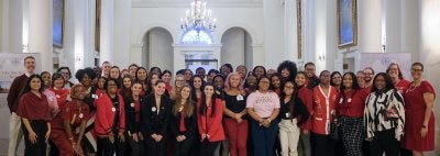 Students and faculty stand in the rotunda of the Maryland State House