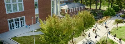 ESJ building on UMD campus while students walk by