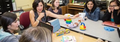 Dr. Natasha Cabrera with her students in the Family Involvement lab