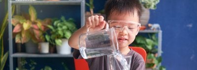 Young child conducting science experiment