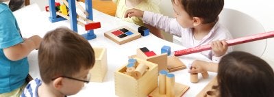 Toddlers play with block