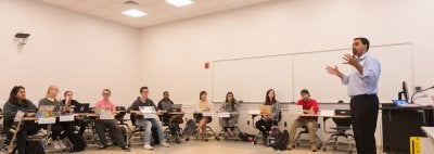 Professor speaks to class of education students