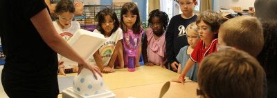 Children looking at balloons in liquid nitrigen