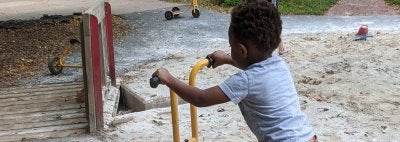 Boy riding scooter