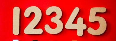 Numbers 1-5 above cubes on red background