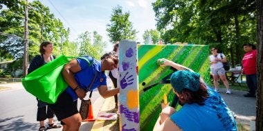 District 2 College Park city council member Llatetra Brown Esters contributes to a community-based art project by members of the Lakeland community of College Park, Clinical Associate Professor Margaret Walker, and College of Education graduate students.