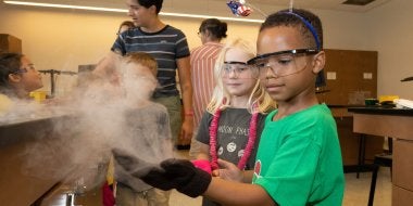 Students at the Center for Young Children visit sites around the UMD campus, such as chemistry labs, to learn about the world. 
