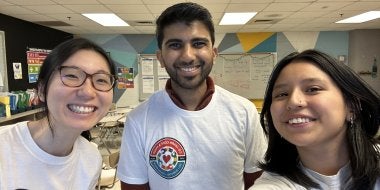 Three UMD graduate students working as facilitators at the Co-Learn Code and Mind afterschool program.