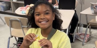 A student at A. Mario Loiederman Middle School learns about robotics at the  Co-Learn Code and Mind afterschool program.