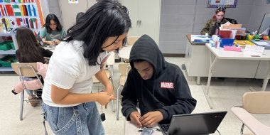 Two students at A. Mario Loiederman Middle School collaborate on a robotics project at the Co-Learn Code and Mind afterschool program.