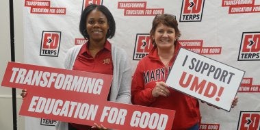 EdTerps hold up signs reading "Transforming Education for Good" and "I Support UMD" on Giving Day 2026.
