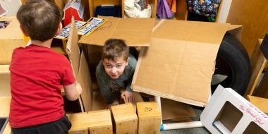 Children play in dramatic play. 