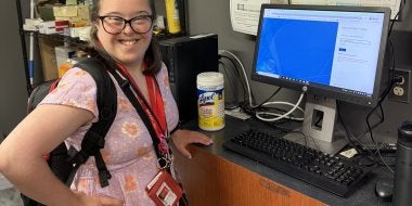 TerpsEXCEED Student at computer in UMD Bookstore