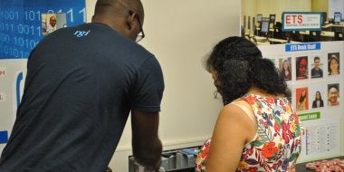 ETS GA Ugo Ifeacho assists Blesilda Lim as she tries to identify computer parts