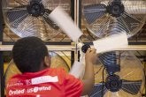 Students test their team's small-scale wind turbine in a wind tunnel at the 2023 Maryland Regional KidWind Challenge.