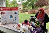 A family engages in an art activity organized by the College of Education's Disability Studies Minor at Maryland Day 2023.