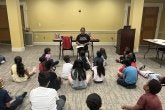 Teacher reading to students - Summer Reading program