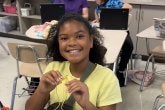 A student at A. Mario Loiederman Middle School learns about robotics at the  Co-Learn Code and Mind afterschool program.