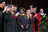 A group applauds for Elaine Johnson Coates '59 as she is honored as a speaker at the Class of 2019's Commencement