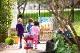 Children paint outside their classroom. 