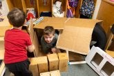 Children play in dramatic play. 