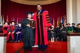 Blesilda Ladines-Lim receiving a President's Distinguished Service Award at the 2026 Faculty and Staff Convocation, with President Darryll J. Pines