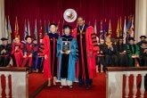 Jing Lin receiving the designation of Distinguished Scholar-Teacher at the 2026 Faculty and Staff Convocation, with Provost Jennifer King Rice and President Darryll J. Pines