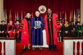 Greg Hancock receiving the designation of Distinguished University Professor at 2026 Faculty and Staff Convocation, with Provost Jennifer King Rice and President Darryll J. Pines
