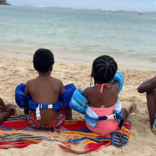 black children looking out to the ocean