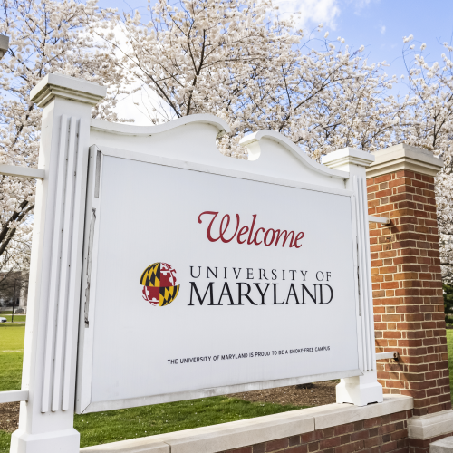 white sign that says 'welcome to the university of maryland'