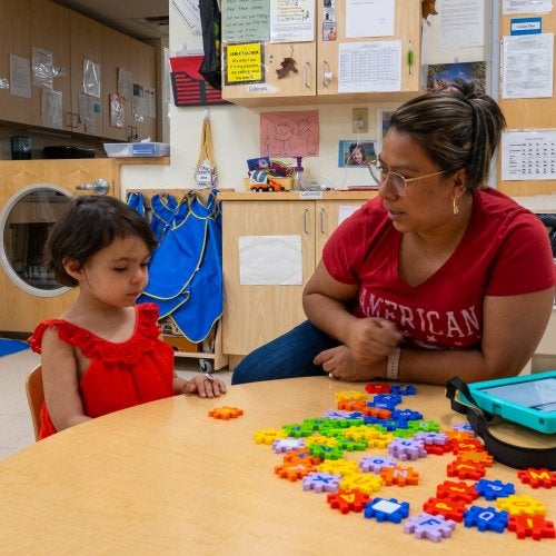 A Maryland Early EdCorp apprentice works with a young child. Photo by Sage Levy