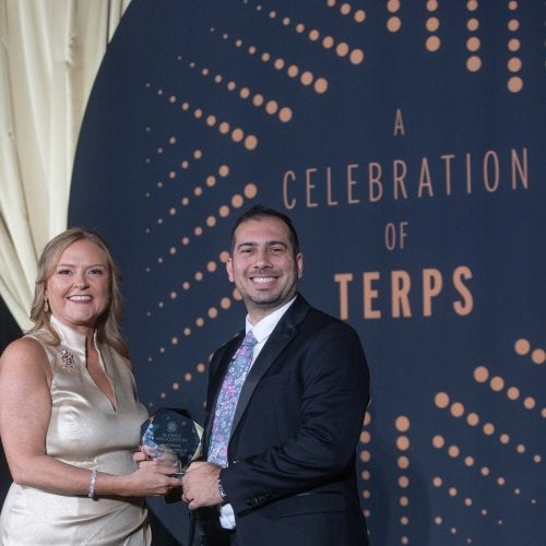 Alumni Association Executive Director Jessica Roberts presents the 2025 Do Good Award to Omar Tarabishi ’13, M.A. ’21