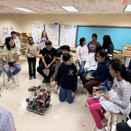 Students at Lakelands Park Middle School participate in a robotics demonstration at the Co-Learn Code and Mind afterschool program.