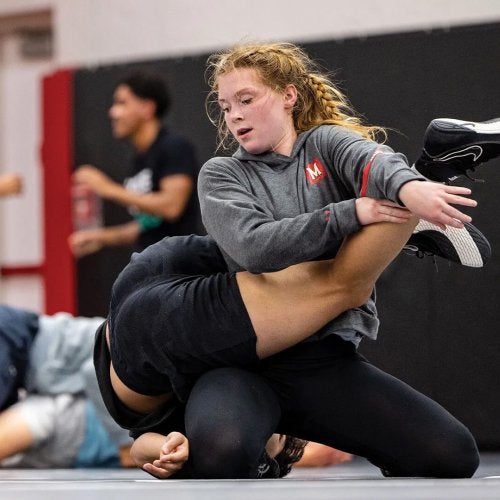 Mckinley Jovanovic practices with another wrestler.