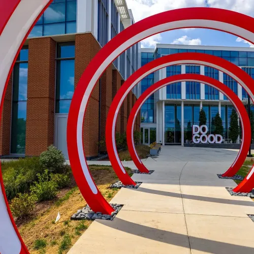 Red rings frame a sculpture of the words "Do Good."