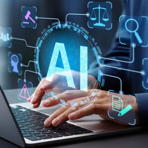 The letters "AI" and various symbols float in front of a photo of hands typing on a laptop.