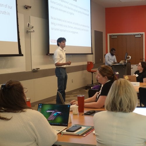 Anderson Harlor ’29 of TerpsVote speaks to a room full of instructors participating in the Civic Engagement Across the Curriculum professional development program.