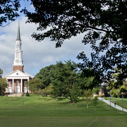 The Memorial Chapel surrounded by tree branches.