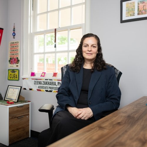 Zeena Zakharia sits in her office.