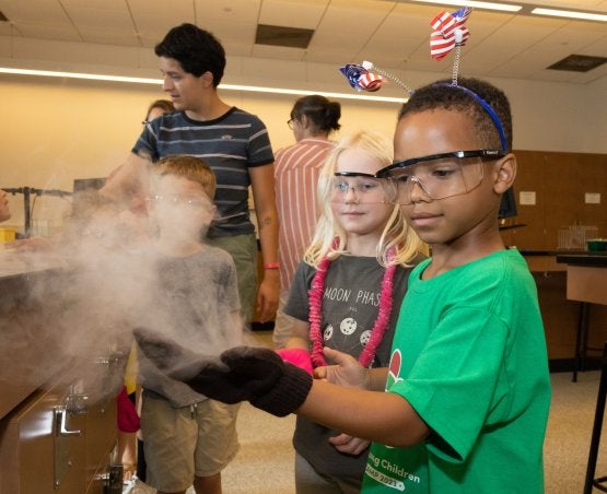 Students at the Center for Young Children visit sites around the UMD campus, such as chemistry labs, to learn about the world. 