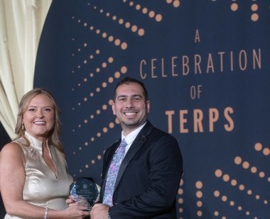 Alumni Association Executive Director Jessica Roberts presents the 2025 Do Good Award to Omar Tarabishi ’13, M.A. ’21