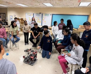Students at Lakelands Park Middle School participate in a robotics demonstration at the Co-Learn Code and Mind afterschool program.