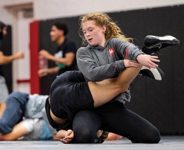 Mckinley Jovanovic practices with another wrestler.