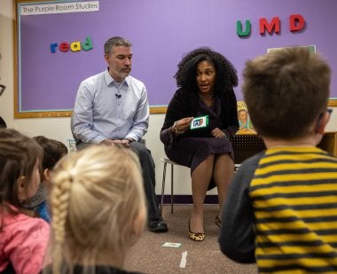 Maryland Initiative for Literacy and Equity Co-Directors Donald J. Bolger, associate professor at UMD, and Simone Gibson Ph.D. ’09, associate professor at Morgan State University, lead literacy activities with children.