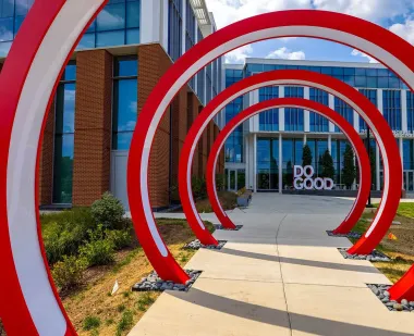 Red rings frame a sculpture of the words "Do Good."