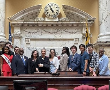 Lena Morreale Scott (fifth from left) and members of the Maryland Civic Education Coalition at the signing of HB0057/SB0204, which established the Maryland Seal of Civic Excellence.