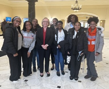 MILE students from Morgan State University pose with Maryland State Superintendent of Schools Carey Wright in the State House.